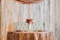 17 a sweetheat table covered with a copper sequin tablecloth and a copper sequin runner in the backdorp