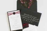 17 black wedding stationery with realistic plum floral lining and prssed florals, plum ribbon and seals