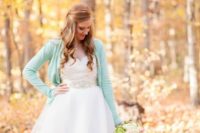 18 a mint cardigan over a wedding dress for a fall or spring bride