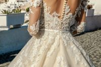 20 champagne lace ballgown with an illusion lace back on neutral buttons