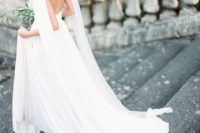 20 elegant open back wedding gown with an embellished cape to make it stand out