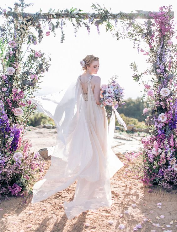 ethereal blush cape attached to the back and shoulders of the dress
