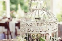 rustic wedding table decor with a birdcage