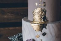 22 a matte pale purple wedding cake layer, a marble layer, gold leaf decor