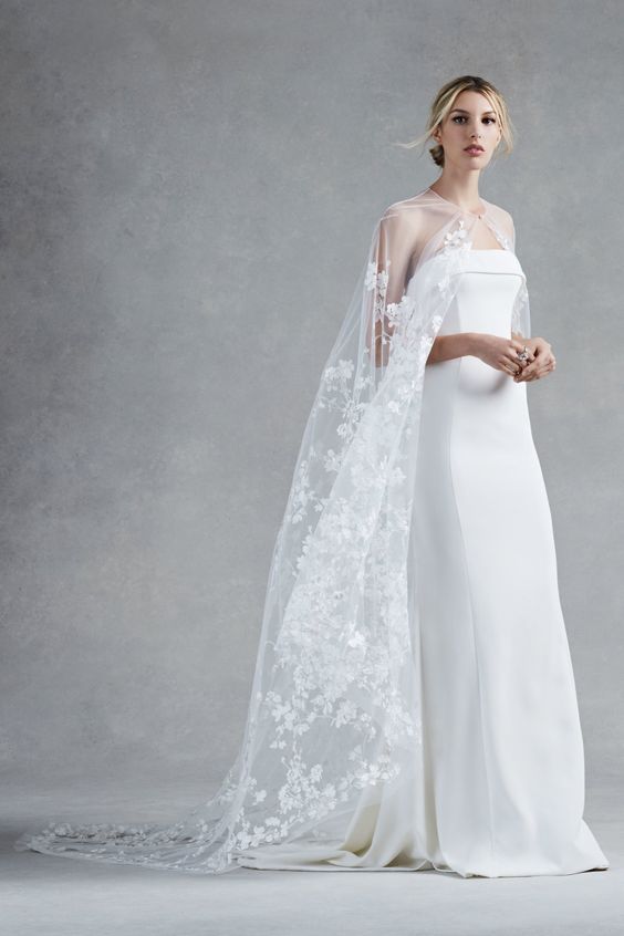 ethereal lace applique cape makes a minimalist wedding dress more feminine