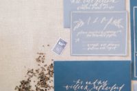 22 indigo envelopes and slate grey invites with silver calligraphy