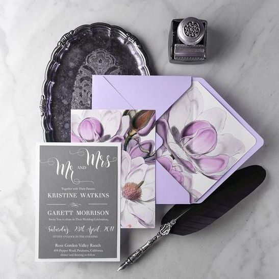 a grey and lavender wedding stationery set with calligraphy and chic blooms