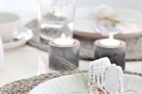 23 concrete candle holders for a minimalist tablescape and wicker chargers for a texture