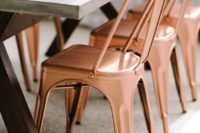 23 copper chairs for an industrial table setting and matching geo centerpieces