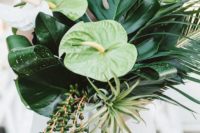 24 a bold tropical wedding bouquet with tropical leavs, blooms and hanging succulents