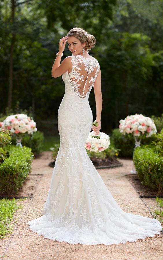 mermaid lace wedding dress with a button row on the illusion back