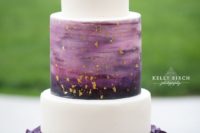 25 a unique modern wedding cake with a purple ruffle layer, white layers, an ombre purple gold leaf layer and a gold leaf top layer