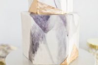26 a watercolor purple wedding cake with gold touches and of a geometric shape