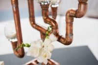 26 copper pipe centerpiece with white blooms and candles looks chic