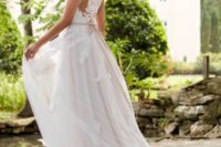 26 romantic cap sleeve wedding dress with an illusion lace back and a sash