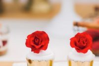 28 creamy cupcakes topped with red roses and in gold foil
