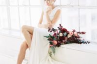 28 modern V-neckline wedding dress with a front slit and strappy lace heels