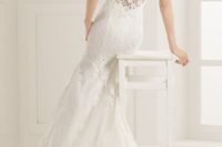 28 sleeveless lace mermaid wedding dress with a illusion back and lace appliques on it