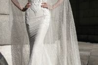 28 spaghetti strap lace applique wedding dress and a see through cape that reminds of snow