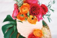 29 display your wedding cake on a large tropical leaf, top it with bold blooms