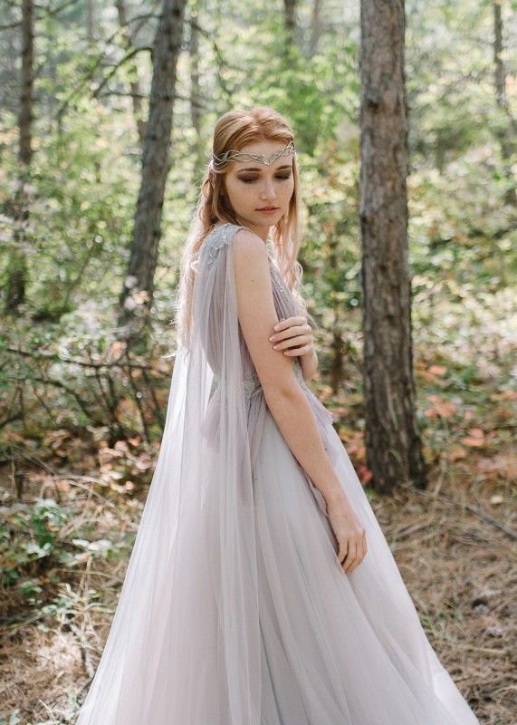 a Galadriel inspired bridal look with a lilac A-line tulle wedding dress with a capelet and a cool headpiece
