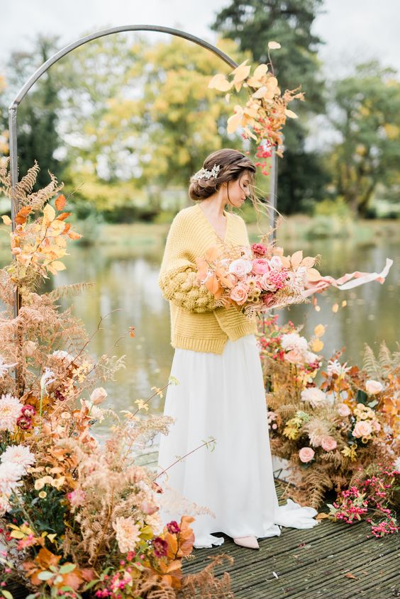 a beautiful yellow chunky knit cardigan will easily add a bright touch of color and will spruce up your look at a fall wedding