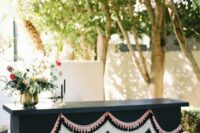 a creative wedding bar design with tassels