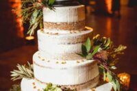 a naked wedding cake decorated with greenery and a cake topper is a cool idea for your fantasy wedding