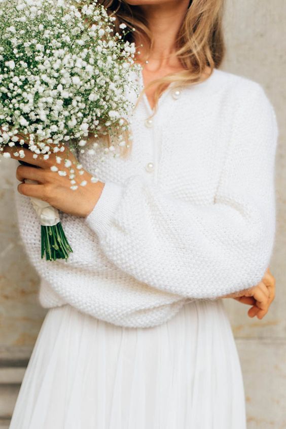 a pretty and simple textural wedding cardigan with pearl buttons is a great idea for a casual or boho bridal look