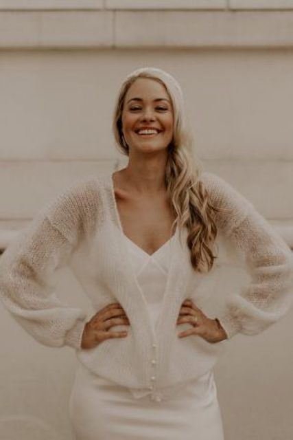a semi-sheer neutral cardigan with pearl buttons is a lovely addition to the bridal look, it will keep you comfortable and chic