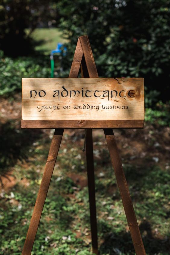 a sign done with traditional letters from LOTR is a cool idea for your fantasy wedding