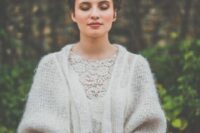 a simple knit cardigan with wide sleeves is a lovely idea for a boho wedding, whether it’s in the woods or not