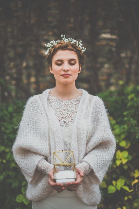 a simple knit cardigan with wide sleeves is a lovely idea for a boho wedding, whether it's in the woods or not