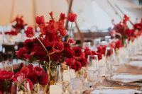 cluster red floral wedding centerpieces paired with elegant candles will make up a super chic wedding tablescape