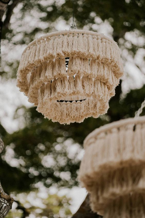 cool and catchy neutral tassel chandeliers will accent a boho wedding space, reception or a ceremony space, they can be DIYed easily