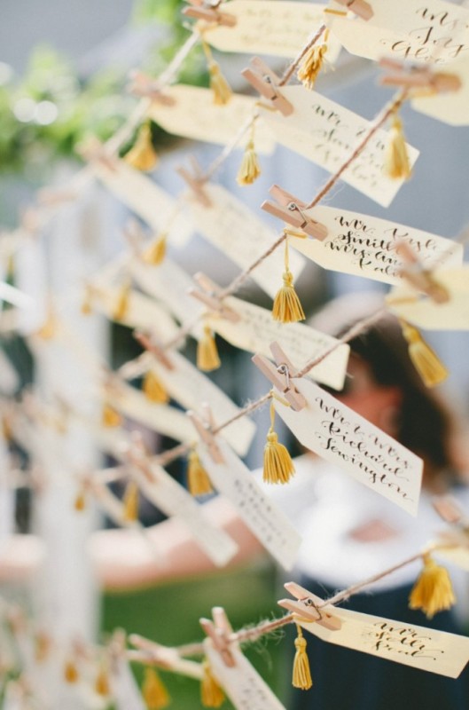 fun escort cards with yellow tassels can be easily DIYed and can be used for many weddings