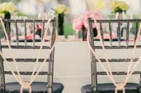 oversized tassels on rope are great to accent your wedding chairs, instead of usual plaques or signs