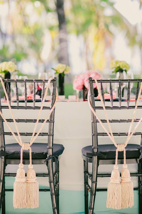 oversized tassels on rope are great to accent your wedding chairs, instead of usual plaques or signs