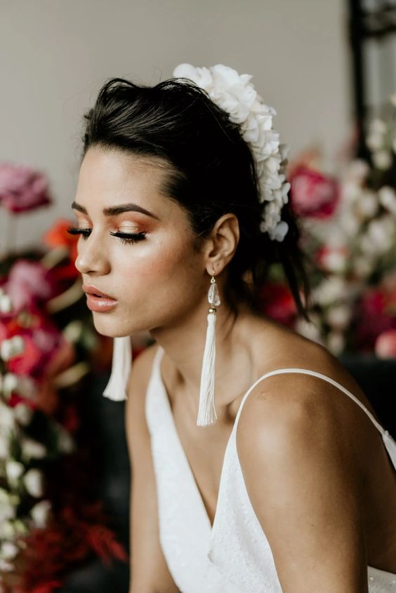 white tassel and seashell earrings are a gorgeous accessory for styling a bridal look, they are chic and catchy