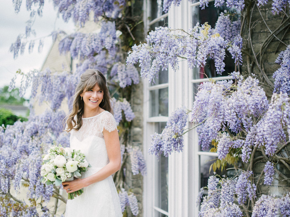 This adorable wedding shoot took place in a beautiful venue with lots of wisteria