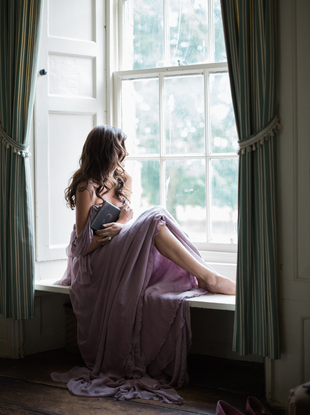 The bride was wearing a flowy lavender-colored dress for the morning preparations