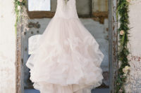 02 The wedding dress was with a textural lace bodice and ruffled blush skirt