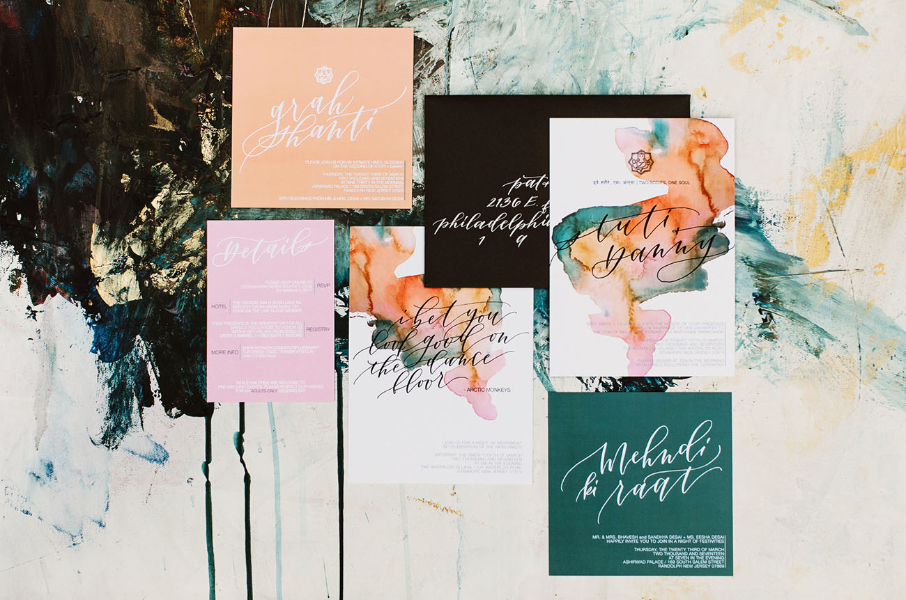The wedding stationery was bold and colorful, with watercolour splashes