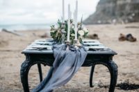 02 flowing graphite grey table runner for a refined winter beach wedding