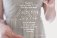 03 an acrylic invitation with white calligraphy is a perfect idea for a minimalist wedding