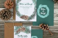 04 a rustic Christmas stationery suite in dark green and with pinecone prints and kraft paper