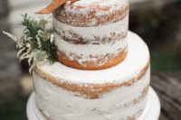 04 a semi naked winter wedding cake topper with herbs and leather for a rustic celebration