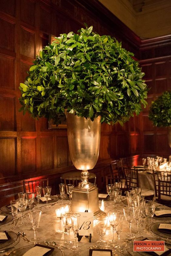 an oversized urn with boxwood for an elegant winter wedding