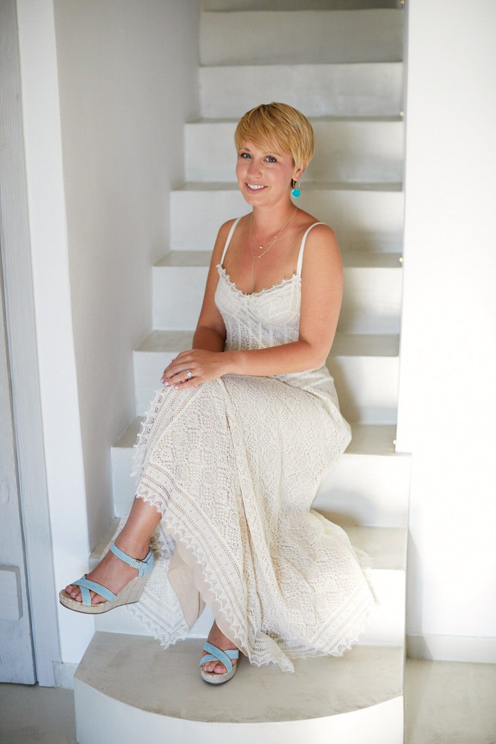 The bride was wearing a gorgeous boho lace wedding dress with spaghetti straps, serenity blue wedges and turquoise earrings
