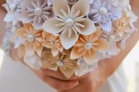 05 a paper flower wedding bouquet of note paper and pearls for a chic look and a music loving bride